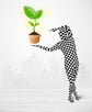 Funny man in full body suit with eco plant, ecological concept